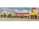 Exterior view of a shopping center with retail stores including Reebok, GAP and Kitchen Collection at 320 Riverbend Dr, Mcdonough, GA 30252