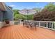 Back deck featuring wicker furniture and a patio umbrella, perfect for outdoor relaxation at 64 Edwin Pl Nw, Atlanta, GA 30318