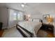 Bedroom with neutral tones, hardwood floors, and a window providing natural light at 64 Edwin Pl Nw, Atlanta, GA 30318