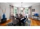 Charming dining room with hardwood floors, stylish decor, and ample natural light at 64 Edwin Pl Nw, Atlanta, GA 30318