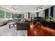 Bright and airy sun room featuring large windows, a comfortable seating area, and a desk at 64 Edwin Pl Nw, Atlanta, GA 30318