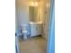 Neat bathroom with tiled floor, and a single vanity at 7220 Winderlea Ln, Cumming, GA 30040