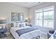 Serene bedroom with a large window, contemporary decor, and stylish bedside tables at 7220 Winderlea Ln, Cumming, GA 30040