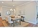 Charming dining room featuring a table set for six, with stylish decor at 7220 Winderlea Ln, Cumming, GA 30040