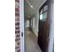 Inviting entryway showcases a dark wood door and hardwood floors, welcoming guests at 7220 Winderlea Ln, Cumming, GA 30040