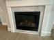 Modern fireplace with white marble surround, creating a focal point in the living space at 7220 Winderlea Ln, Cumming, GA 30040