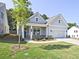 Charming home exterior with well-maintained lawn and welcoming entrance at 7220 Winderlea Ln, Cumming, GA 30040