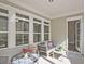 Cozy covered patio with comfortable seating and ample natural light at 7220 Winderlea Ln, Cumming, GA 30040