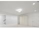 Bright and spacious basement area featuring neutral carpet, recessed lighting, and ample closet space at 130 Forrest Aly, Roswell, GA 30075