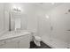 Modern bathroom with glass shower, dual sinks, and stylish tile flooring at 130 Forrest Aly, Roswell, GA 30075