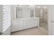 Elegant bathroom with double sinks, a walk-in shower, and abundant natural light at 130 Forrest Aly, Roswell, GA 30075
