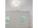 Bright bedroom with white walls and plantation shutters on the windows at 130 Forrest Aly, Roswell, GA 30075