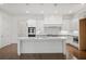 Modern kitchen featuring a large center island, stainless steel appliances, and subway tile backsplash at 130 Forrest Aly, Roswell, GA 30075