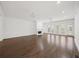 Expansive living area with hardwood floors, fireplace, and ample natural light at 130 Forrest Aly, Roswell, GA 30075