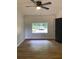 Bedroom with ceiling fan and a view of the outdoors at 3080 Hogan Sw Rd, Atlanta, GA 30331