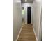 Hallway features hardwood-style floors and neutral wall paint at 3080 Hogan Sw Rd, Atlanta, GA 30331