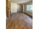 Spacious living room with new hardwood floors and stone fireplace, great for entertaining at 3080 Hogan Sw Rd, Atlanta, GA 30331