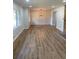 Spacious living room with new hardwood floors, lots of natural light, great for entertaining at 3080 Hogan Sw Rd, Atlanta, GA 30331