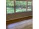 Relaxing sun room with new hardwood floors and lots of natural light, great for quiet enjoyment at 3080 Hogan Sw Rd, Atlanta, GA 30331