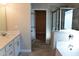 Bright bathroom features a standalone tub, a walk-in shower, and a walk-in closet at 505 Brown Dove Ln, Grayson, GA 30017