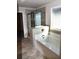 Relaxing bathroom featuring a standalone tub and a tiled glass shower at 505 Brown Dove Ln, Grayson, GA 30017