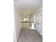 Cozy upstairs loft area with neutral colors and a window overlooking the front yard at 505 Brown Dove Ln, Grayson, GA 30017