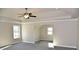 Large main bedroom features a tray ceiling, large windows, and neutral paint at 505 Brown Dove Ln, Grayson, GA 30017