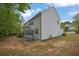 Exterior side view of home with patio at 5155 Amberden Hall Dr, Suwanee, GA 30024