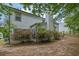 Exterior side view of home with budding azaleas at 5155 Amberden Hall Dr, Suwanee, GA 30024
