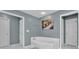Bathroom featuring tub, double door access and artwork on the wall at 5155 Amberden Hall Dr, Suwanee, GA 30024