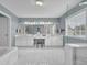 Spacious bathroom with marble tile, double vanity, and separate bathtub at 5155 Amberden Hall Dr, Suwanee, GA 30024
