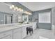 Bathroom featuring tub, shower, double vanity, marble tile, and lots of light at 5155 Amberden Hall Dr, Suwanee, GA 30024