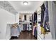 Walk-in closet with ample hanging space and shelving at 5155 Amberden Hall Dr, Suwanee, GA 30024