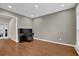 Elegant room showcasing a grand piano, hardwood floors, and ample natural light at 5155 Amberden Hall Dr, Suwanee, GA 30024