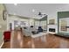 Spacious living room with fireplace, hardwood floors, and plenty of natural light at 5155 Amberden Hall Dr, Suwanee, GA 30024