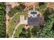 Aerial perspective showcasing the home's backyard, pool, waterslide, and extensive grounds at 7180 Westray Rd, Cumming, GA 30028
