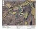Aerial view of the property and surrounding acreage in a wooded area at 7180 Westray Rd, Cumming, GA 30028