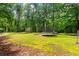 Spacious backyard featuring two trampolines and ample space for recreation at 7180 Westray Rd, Cumming, GA 30028