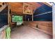 Inside horse barn with wooden stalls and high ceilings; great for livestock at 7180 Westray Rd, Cumming, GA 30028
