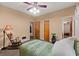Comfortable bedroom featuring a ceiling fan, natural light, and ample space at 7180 Westray Rd, Cumming, GA 30028