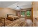 Spacious bedroom with wood-look flooring and lots of natural light at 7180 Westray Rd, Cumming, GA 30028