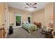 Cozy bedroom with natural light, rocking chair and decor at 7180 Westray Rd, Cumming, GA 30028