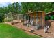 Unique chicken coop with enclosed run and charming decor, perfect for hobby farmers at 7180 Westray Rd, Cumming, GA 30028