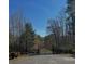 Long driveway leading to a home, framed by a wooden fence at 7180 Westray Rd, Cumming, GA 30028