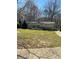 Well-maintained single-story home with lawn, landscaping, and front porch at 7180 Westray Rd, Cumming, GA 30028