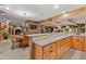 Bright kitchen with an island, custom cabinets, and tile floors at 7180 Westray Rd, Cumming, GA 30028