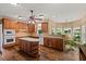 Kitchen with a center island, hardwood floors, stainless steel appliances, and breakfast nook at 7180 Westray Rd, Cumming, GA 30028