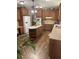 Spacious kitchen features granite counters, abundant wooden cabinets, and a central island at 7180 Westray Rd, Cumming, GA 30028