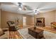 Living room featuring wood-look flooring, a large rug, and ample seating at 7180 Westray Rd, Cumming, GA 30028