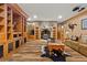 Cozy living room with fireplace, hardwood floors, and built-in shelves at 7180 Westray Rd, Cumming, GA 30028